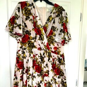 Velvety light pink with red flowers and green leaves